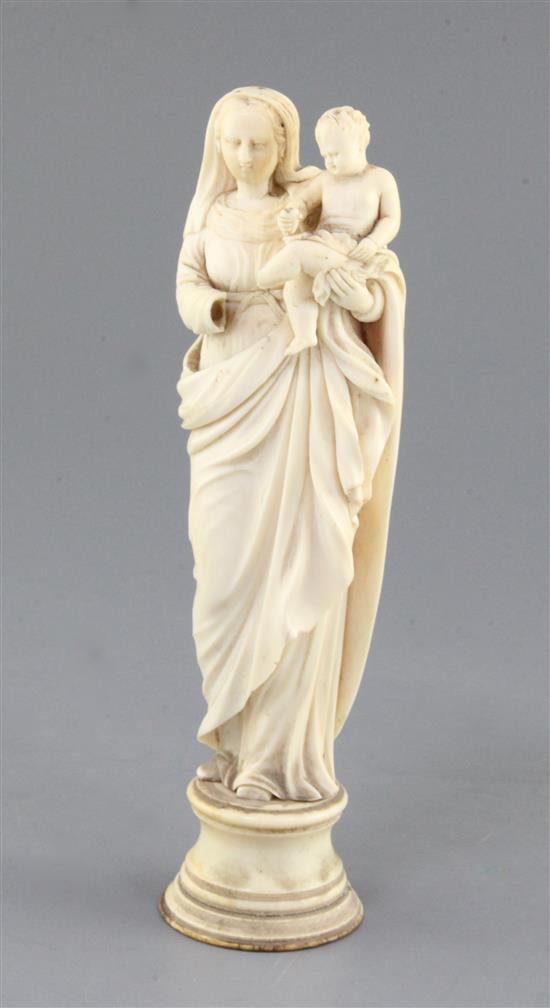 A Continental ivory group of standing Virgin and child, 18th /19th century, height 8.8in.